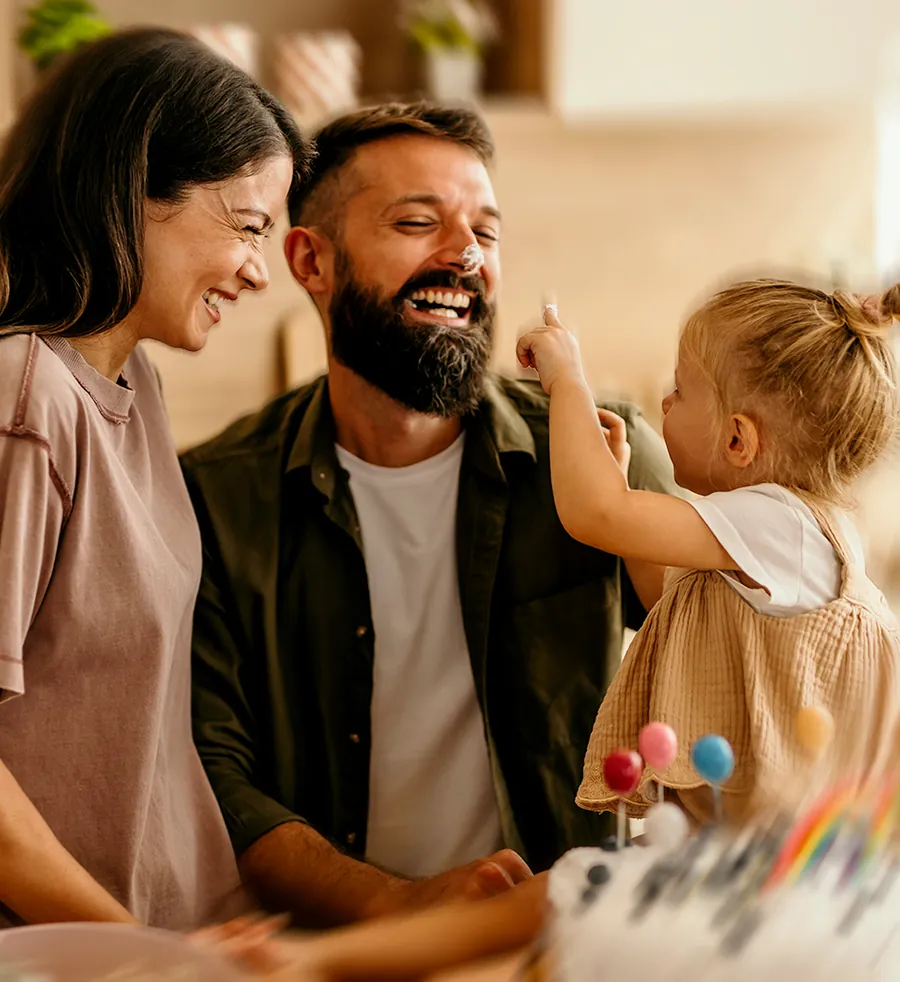 A family at home, supported by Trinity ARM benefits