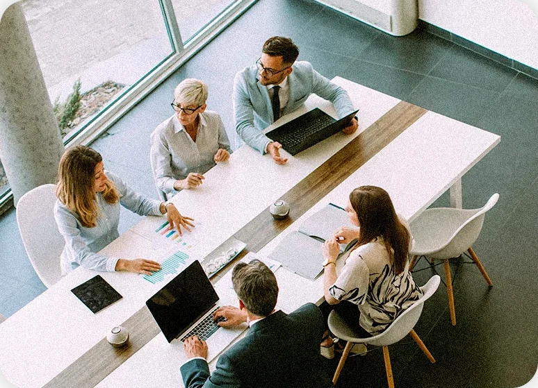 The Trinity ARM team working together around one table