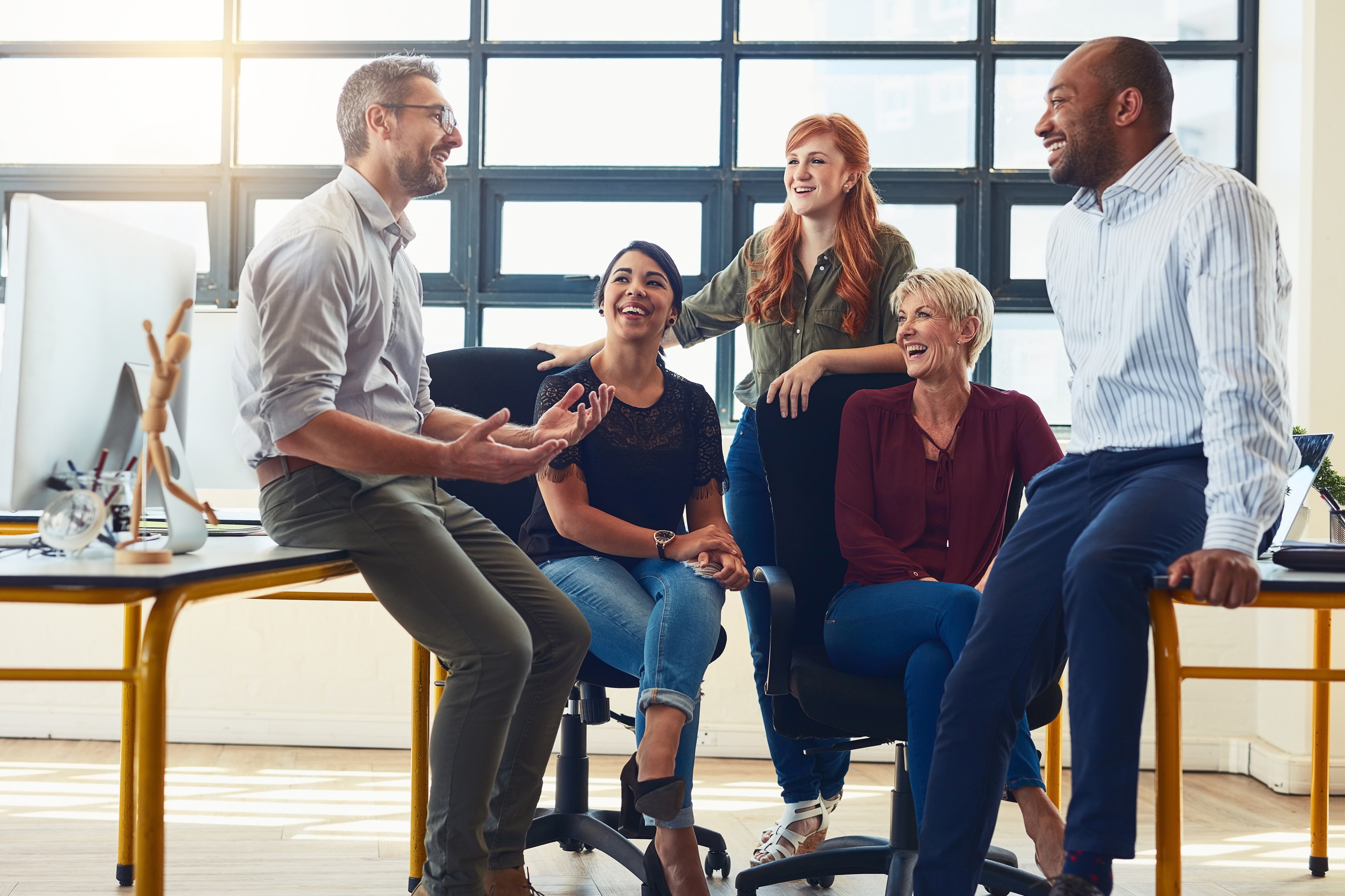 Shot of a group of designers having a discussion in an office.
